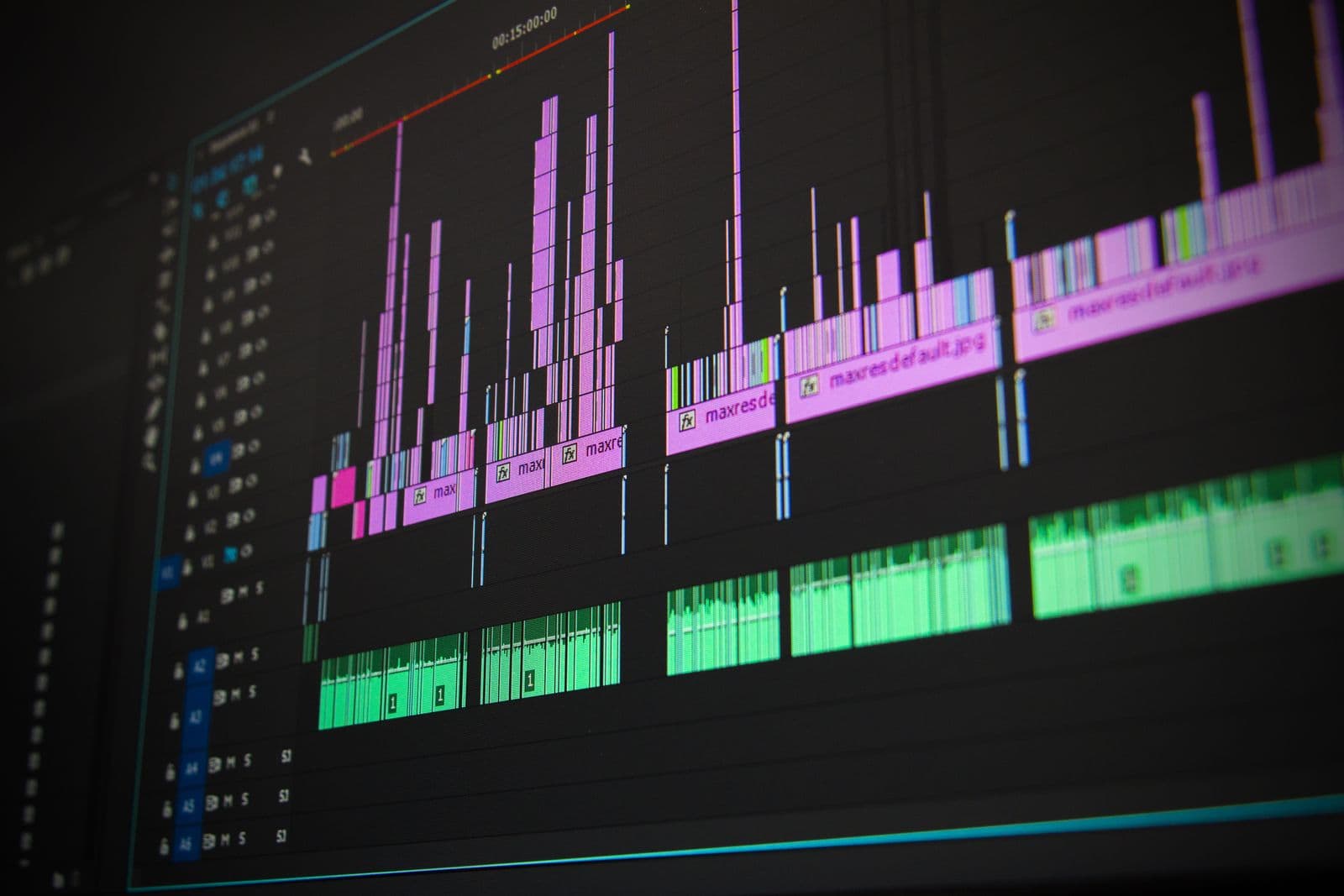 A video editing timeline glowing on a dark screen
